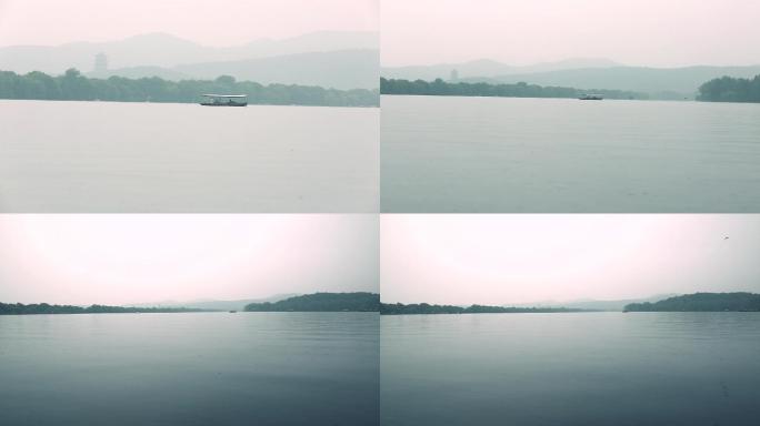 雨后杭州，烟雨濛濛，西湖上的游船