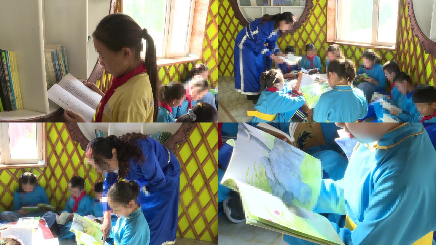 蒙古族学生身穿民族服装在图书角看书