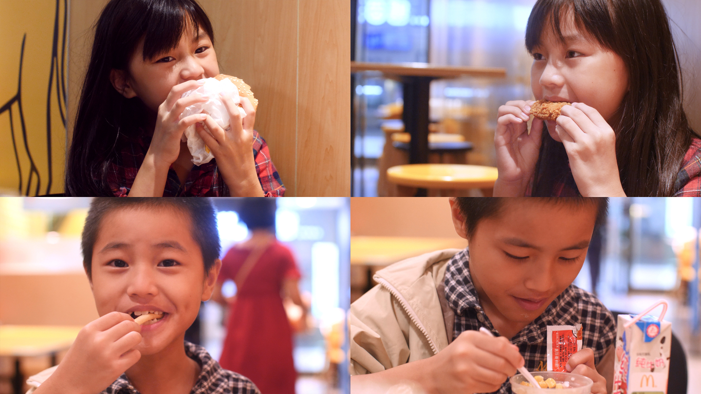 孩子大快朵颐吃麦当劳吃汉堡4k视频素材