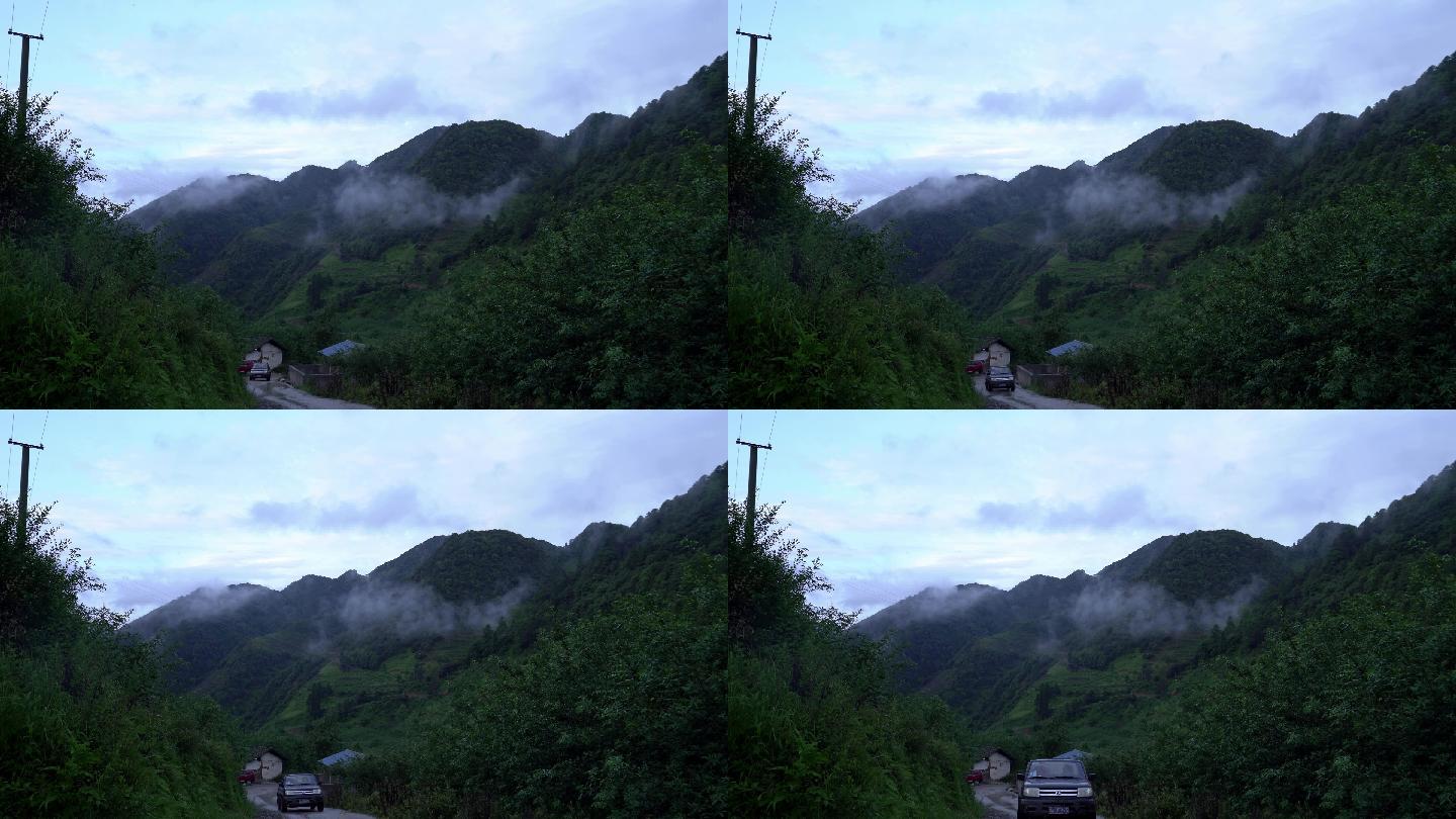 山谷山林早晨雾气一辆汽车驶过