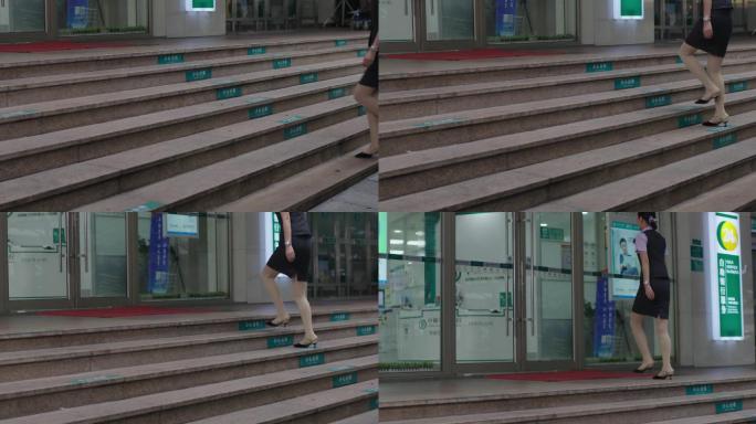 4K高清升格拍摄，职员走上台阶走入银行。