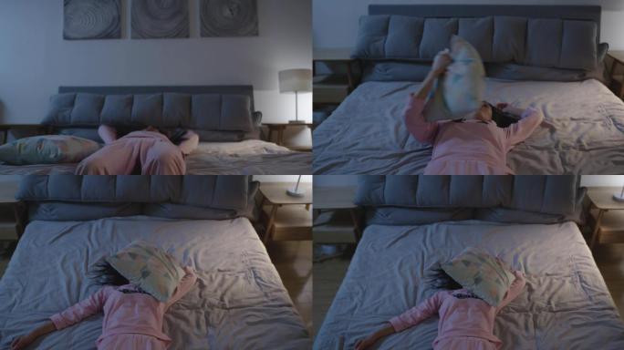 4K高清拍摄，头痛欲裂倒在床上盖上枕头。