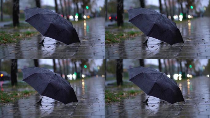 地面遗弃雨伞下雨天忧伤积水寒心分手伤心