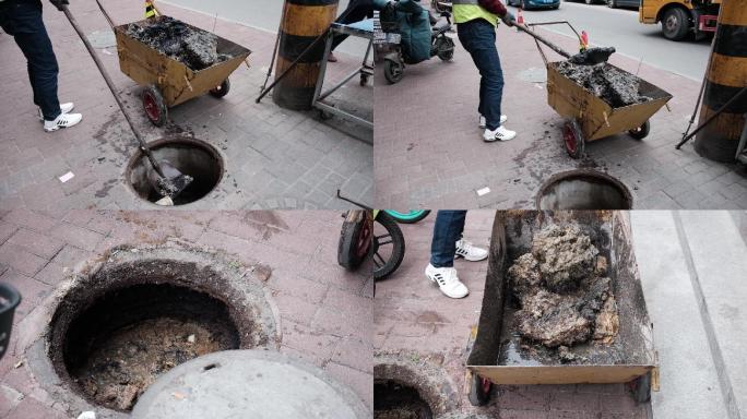 市政工人对城市污水井排污养护实拍