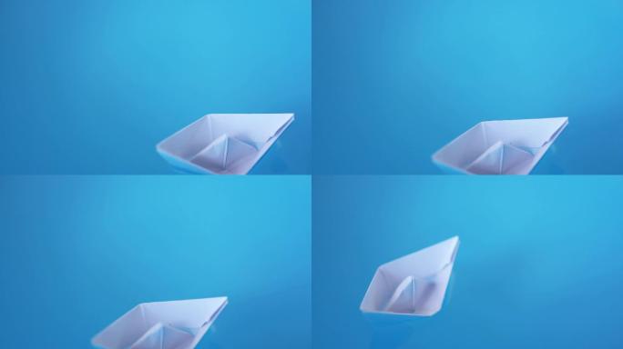 白纸折的小船漂在水面上
