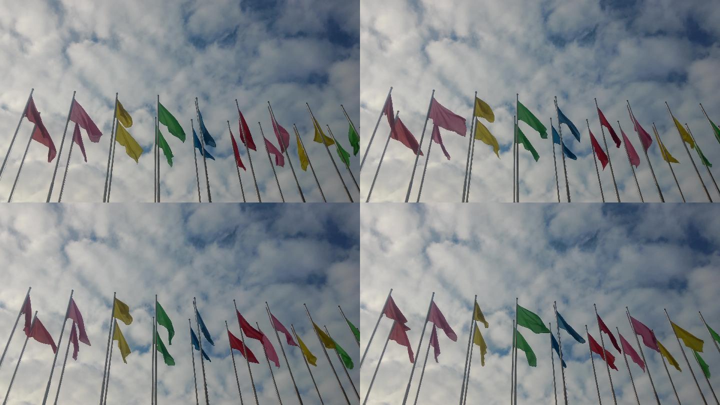 4K视频蓝天白云下的彩色旗帜景观