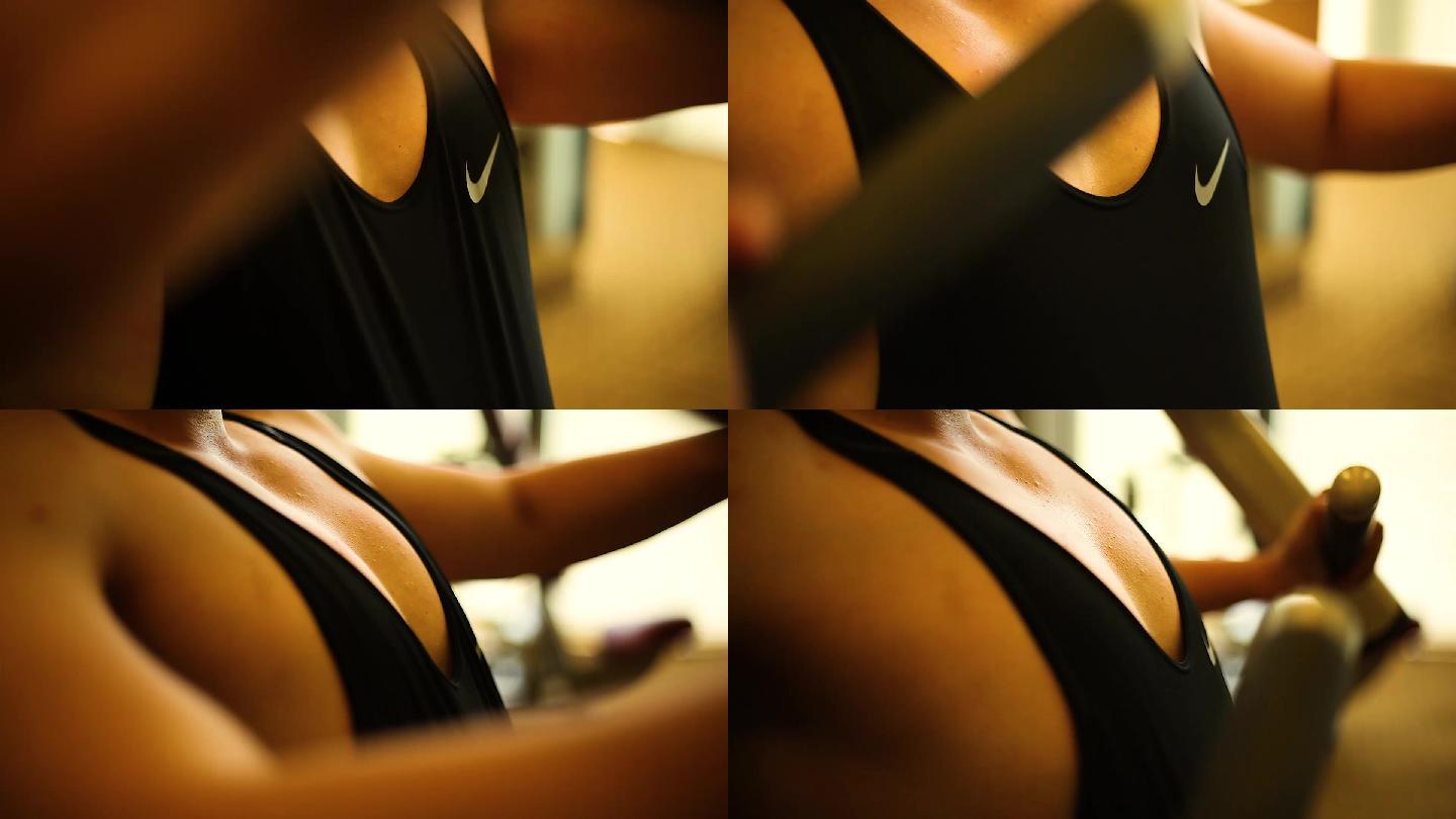 健身房里的练夹胸和肱二头肌练习特写