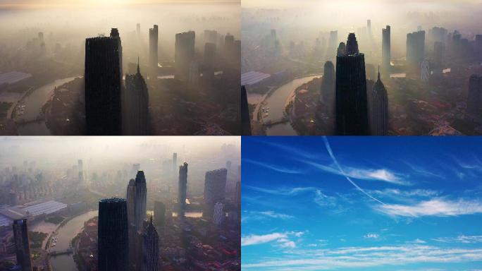 航拍天津市雾中津塔和多云的天空