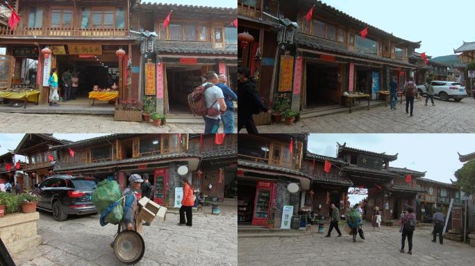 云南丽江白沙古镇游客捡破烂的纳西族老年妇