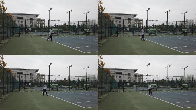 一名男子在网球场打网球