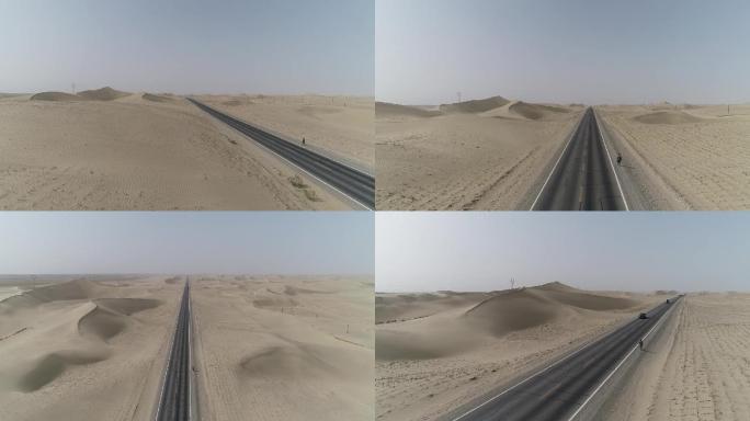 一个人行走在沙漠公路上