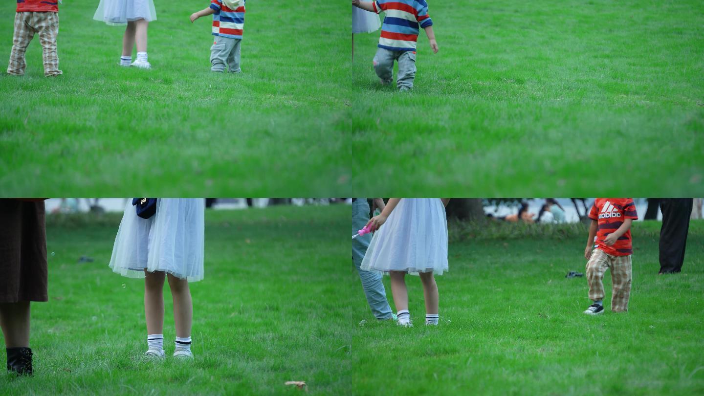 嬉戏的小朋友在草地上快乐的玩耍