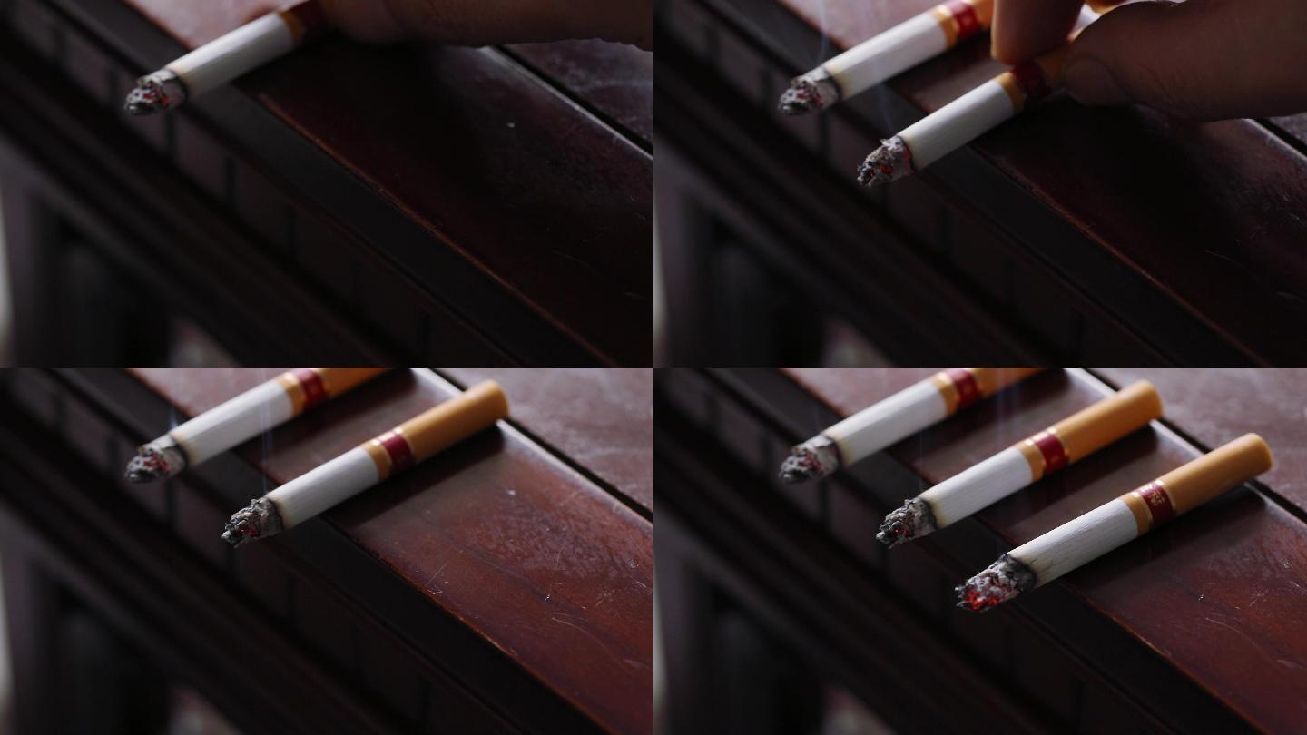 放在桌子边上的三支点燃的香烟