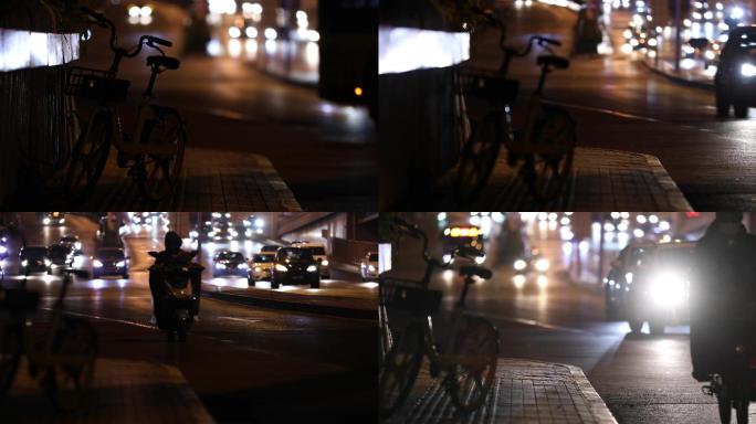 北京夜晚街景，迎面车灯，自行车，车水马龙