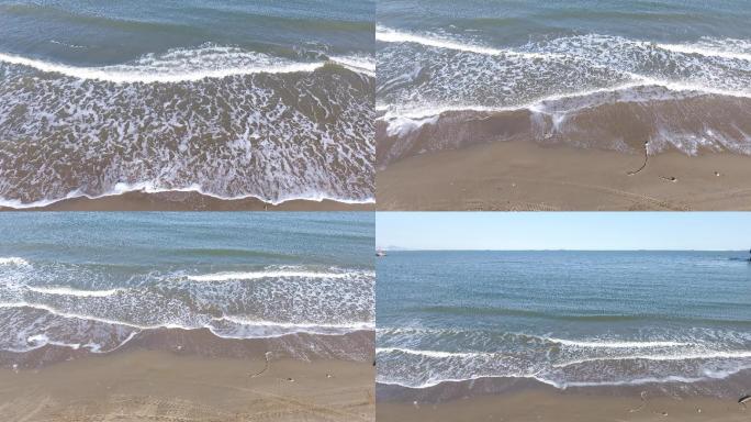 4K航拍海边海浪冲向沙滩原始素材