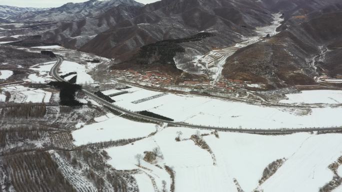 航拍中国北方雪后雪景山景村庄