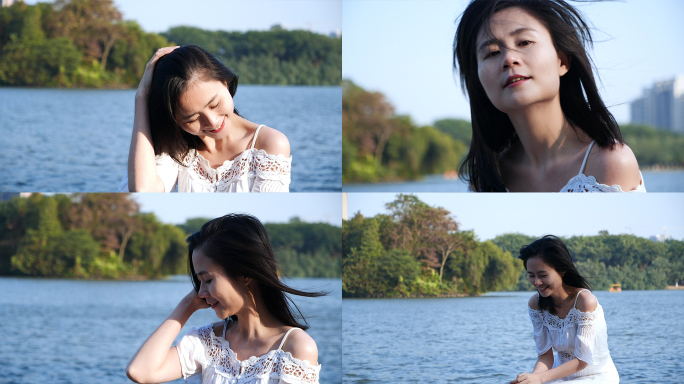 女孩坐在湖边吹风，享受生活感受阳光视频