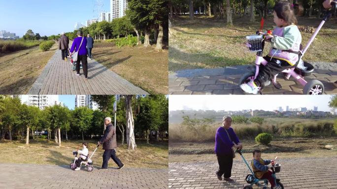 公园里推着婴儿车的老人和孩子