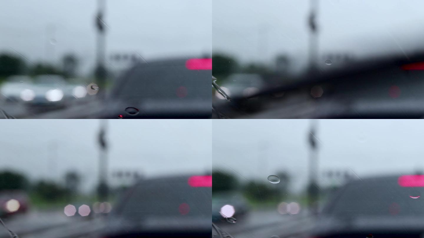 城市车窗玻璃外滑落的雨水