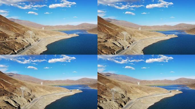 航拍西藏阿里地区山峰湖边公路
