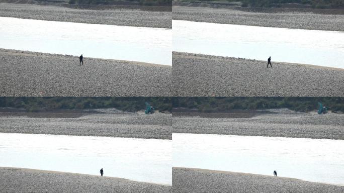 孤单流连在河滩的身影