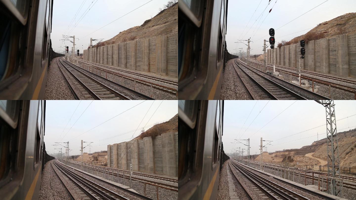 从火车窗口拍摄火车行驶在西北铁路弯道上