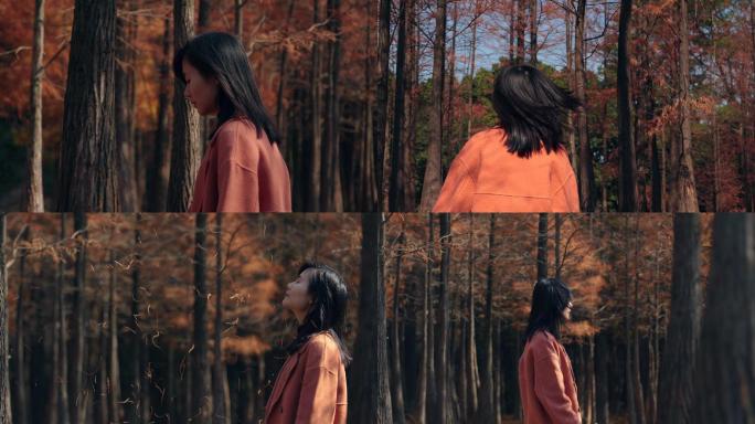 女孩在秋天树林行走慢镜头视频素材