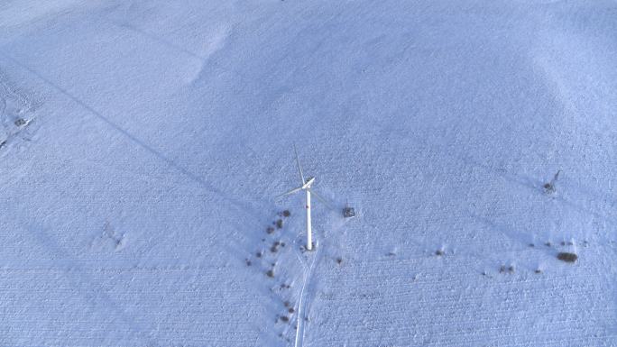 航拍雪地风机风力发电机塞罕坝