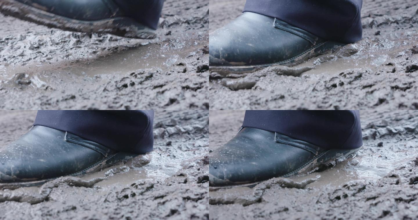 穿皮鞋脚踩泥泞路面特写镜头视频