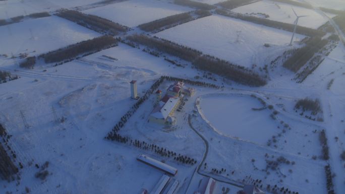 航拍雪地风机风力发电机塞罕坝