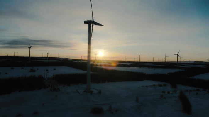 航拍雪地风机风力发电机风场站