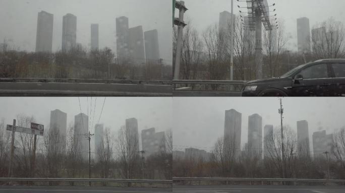 北京望京高楼冬天高速公路上雪花飞舞