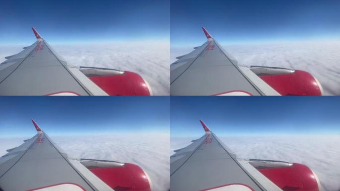 飞机在蓝天白云之间飞行
