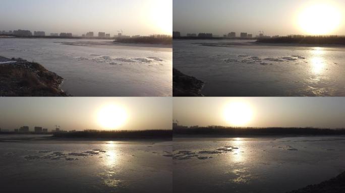 夕阳下流凌的黄河河道