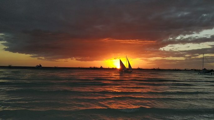 菲律宾长滩岛落日风帆海边夕阳