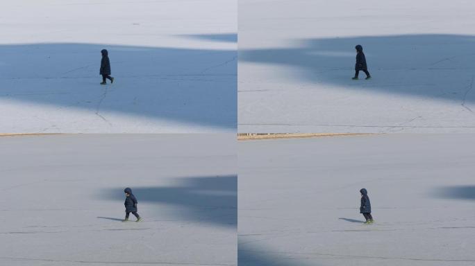 实拍冰雪上独行的小男孩4k