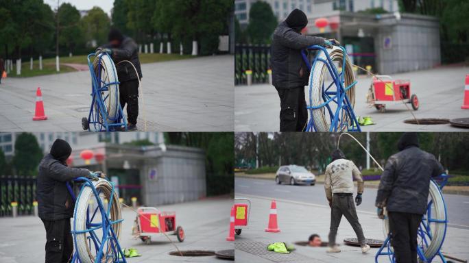 疏通下水道城市管道下水道工人施工作业