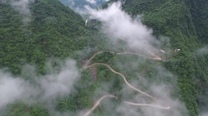 航拍车辆行走在崎岖山路