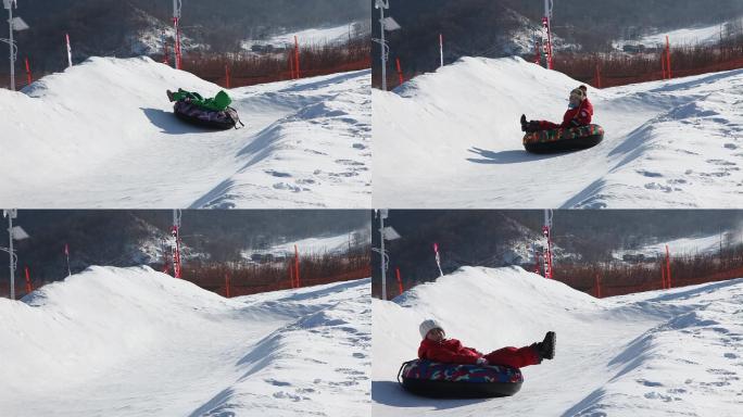 滑雪场玩雪圈的孩子们