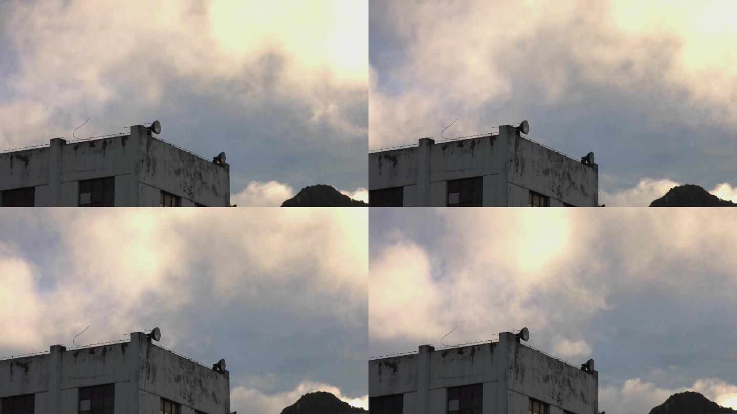 老旧房子屋顶延时摄影天空白云
