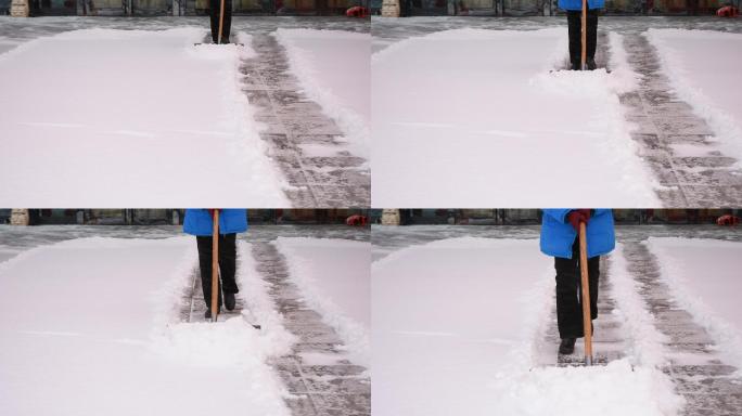 大雪中扫雪除雪的人