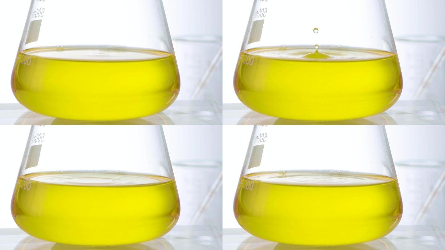 化妆品黄色料体液体水滴落实验素材