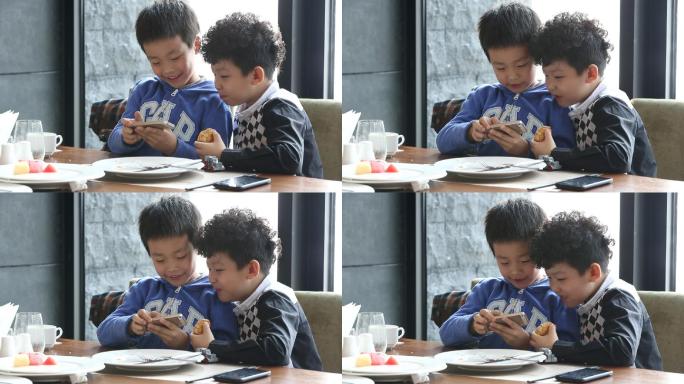 餐品里用餐孩玩手机的孩子