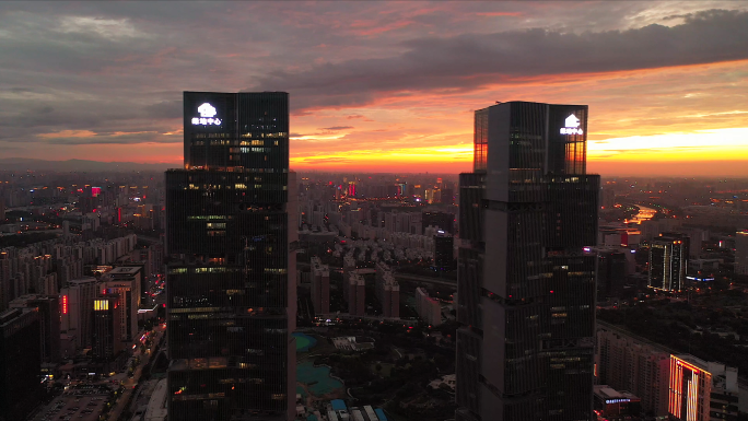 河南郑州东区绿地中心航拍夕阳城市夜景4k