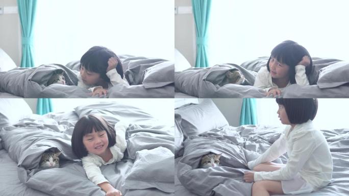 孩子与宠物猫在床上玩耍4k视频素材