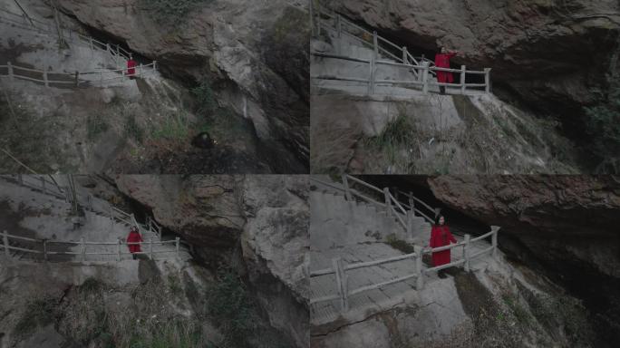 唯美女孩在山上看瀑布