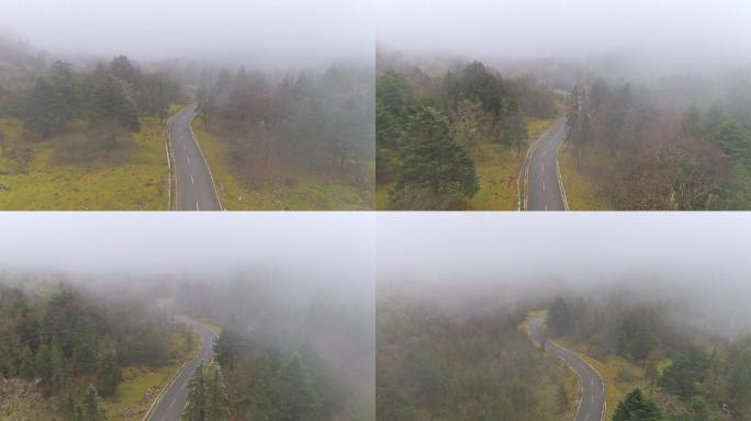 浓雾笼罩的山里公路航拍