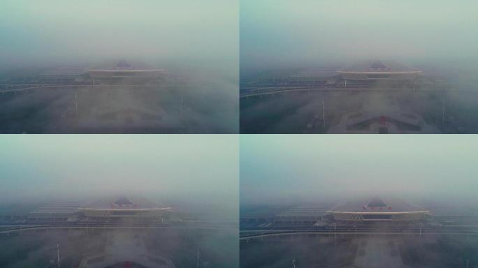 航拍晨雾中的襄阳东站高铁站火车站