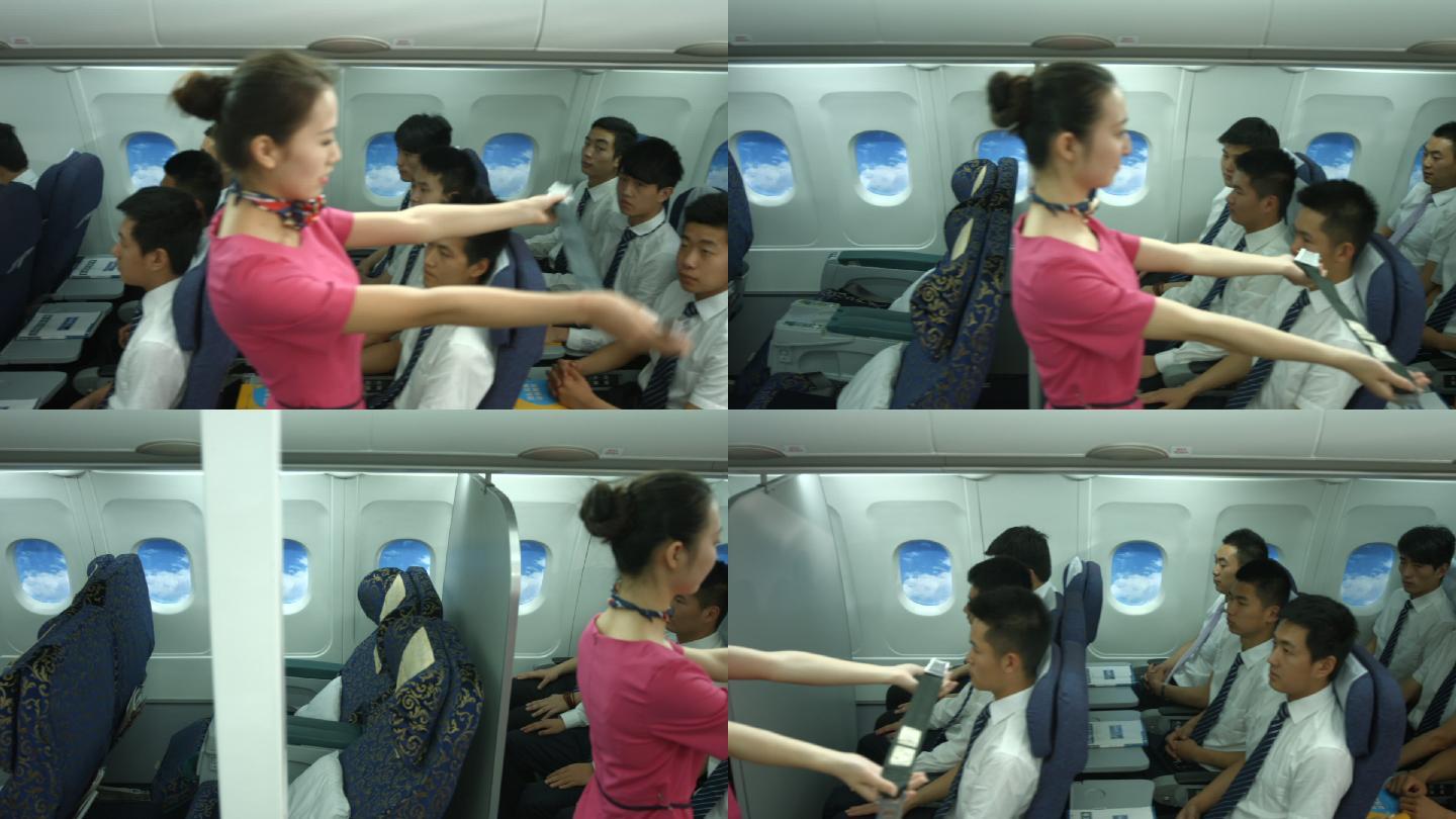 美女空姐向乘客示范安全带规范操作