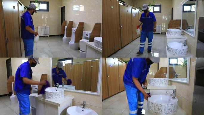 清洁工环卫工人给公共厕所消毒擦拭洗手池